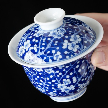 Hand-painted floral blue and white porcelain teacup and saucer