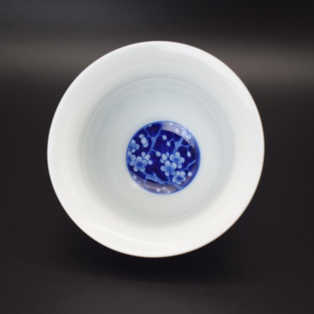 Hand-painted floral blue and white porcelain teacup and saucer