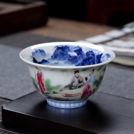 Porcelain teacup with hand-painted figures