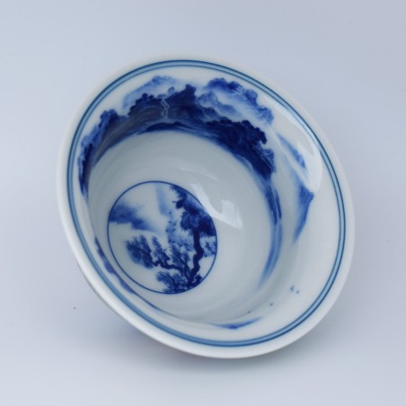 Porcelain teacup with hand-painted figures