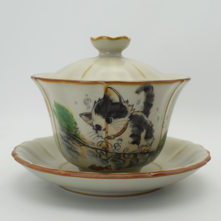 Cute cat playing ice crack teacup