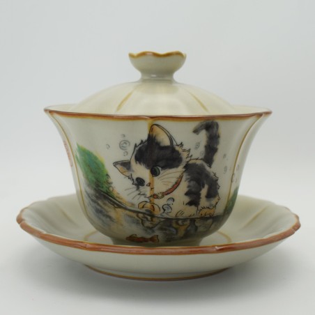 Cute cat playing ice crack teacup