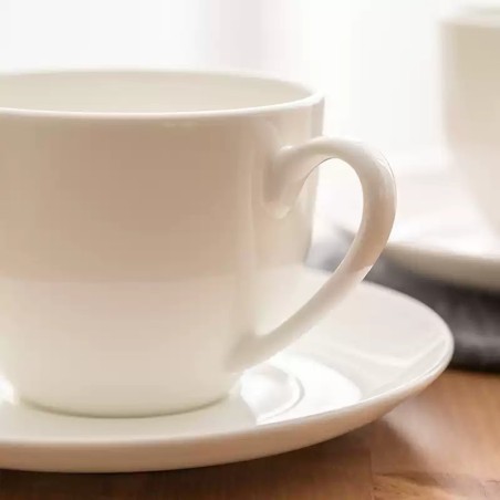 Smooth white ceramic coffee cup and saucer