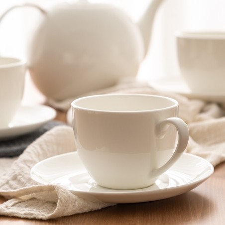 Smooth white ceramic coffee cup and saucer